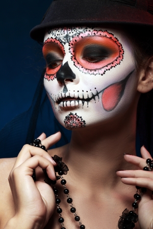 Sugar skull girl in hat, studio shotの写真素材