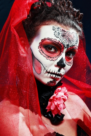halloween make up sugar skull beautiful model with perfect hairstyle. Santa Muerte concept.の写真素材