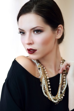 Beautiful woman with evening make-up. Jewelry and Beauty. Fashion photoの写真素材