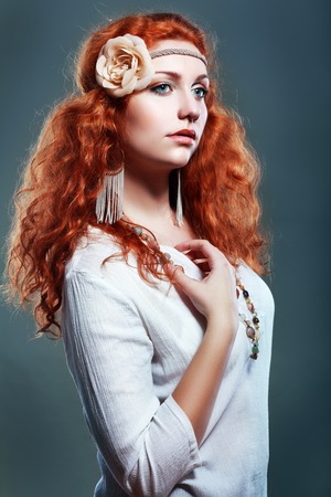 Fashion photo of a young woman with red hair. Close-up portraitの写真素材