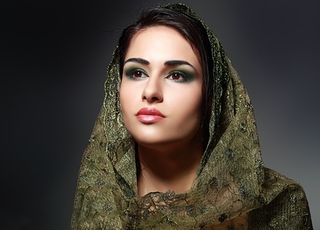 Indian beauty face close up perfect make up headscarf. Series. young beautiful brunette in traditional national dressの写真素材