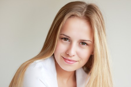 headshot of beautiful teen girl smiling with nice babysmileの写真素材