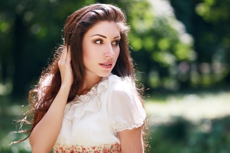 beautiful brunette woman outdoor looking to copyspaceの写真素材