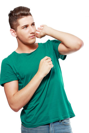 Scared man hiding behind his hands from something unseen
