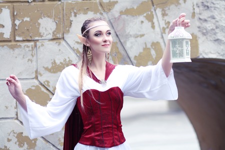 Stylish portrait of a beautiful young girl elf princess magical fashion toningの写真素材