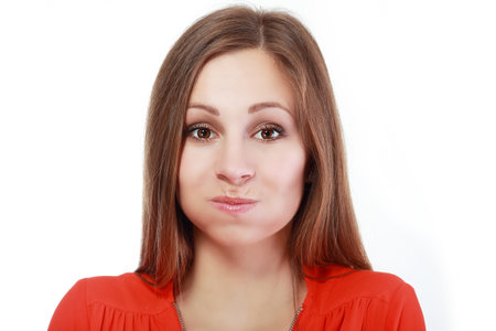 Holding Her Breath - This is a shot of a woman making a funny face with puffy cheeks while holding...