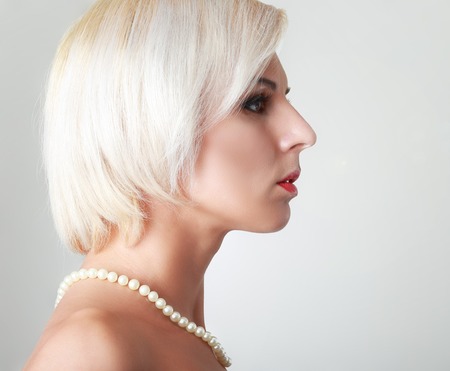 Haircut. Beautiful Girl with Healthy Short Blond Hair. Hairstyleの写真素材