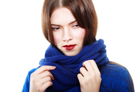 Close up portrait of smiling beautiful brunette female in blue sweater fashion shotの写真素材