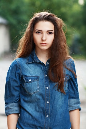 Style teen girl with backpack standing outdoorの写真素材