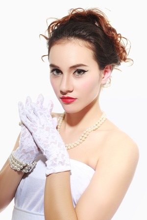 Beautiful portrait of sensual european young woman model with glamour red lips make-up, eye arrow makeup, purity skin. Retro beauty styleの写真素材