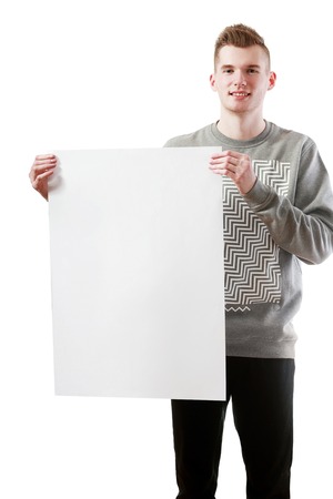 handsome young man holding big white blankの写真素材