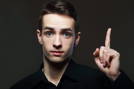 excited man have an idea, studio shot over dark background