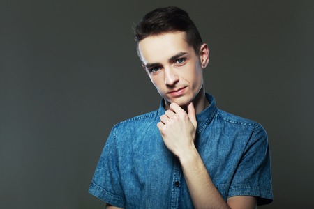 Closeup portrait of confident man thinkingの写真素材