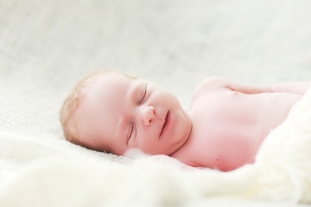 beautiful new born little boy sleepingの写真素材