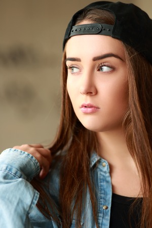 beautiful teen woman outdoor portrait serious faceの写真素材