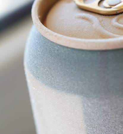 macro shot of frosted ised beer or fresh drink can top, covered with ice overfrosted, shallow depthの写真素材