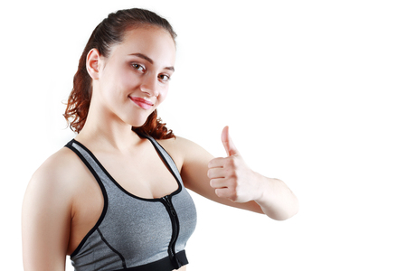 sport fitness woman excited smile show thumb up gesture, happy girl, isolated on white backgroundの写真素材