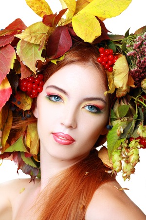 Autumn Woman. Beautiful makeup isolated over white backgroundの写真素材