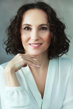 beautiful middle age woman smiling to cameraの写真素材