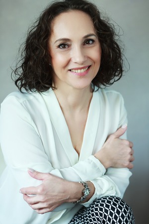 beautiful middle age woman smiling to cameraの写真素材
