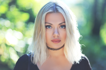 beautiful close up dreamy portrait of blond girlの写真素材