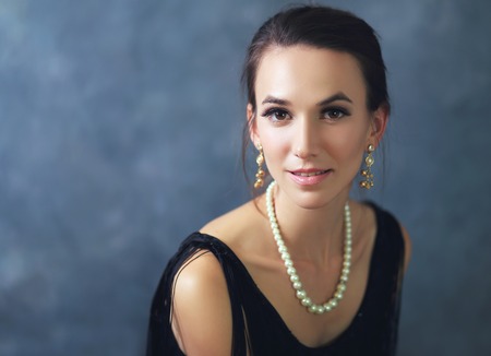 portrait of beautiful glamour stylish woman in little black dressの写真素材