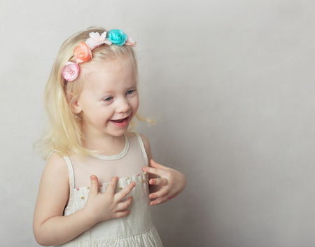 studio portrait of beautiful little girl smilingの写真素材