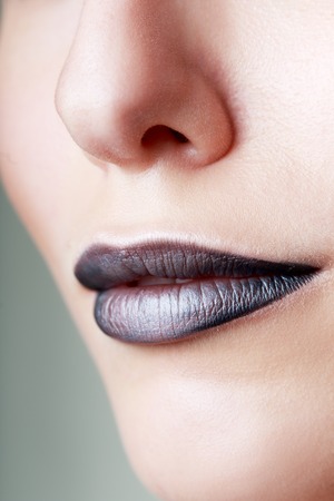 Dark lipstick make up on lips macro close upの写真素材