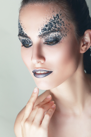 beautiful female model with art fantasy make up face paintの写真素材