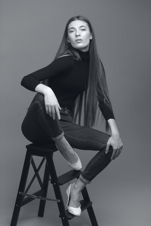 studio portrait of the beautiful young woman with long hair monochrome black and whiteの写真素材
