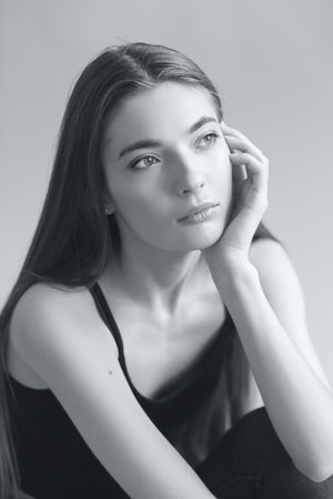 studio portrait of the beautiful young woman with long hair monochrome black and whiteの写真素材