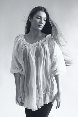 studio portrait of the beautiful young woman with long hair monochrome black and whiteの写真素材