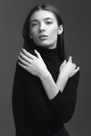 studio portrait of the beautiful young woman with long hair monochrome black and whiteの写真素材