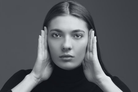 studio portrait of the beautiful young woman with long hair monochrome black and whiteの写真素材