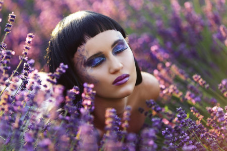 creative make up on fashion model in lavender fieldの写真素材