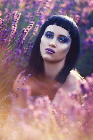 creative make up on fashion model in lavender fieldの写真素材