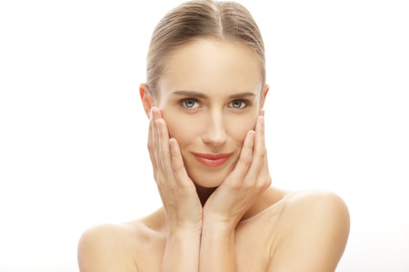 beautiful young woman face isolated over white cosmetic conceptの写真素材