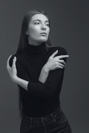 studio portrait of the beautiful young woman with long hair monochrome black and whiteの写真素材