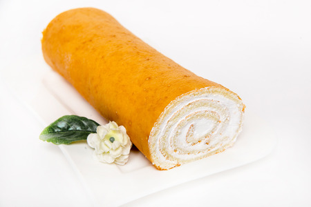 roll with cream lie on a white backgroundの写真素材