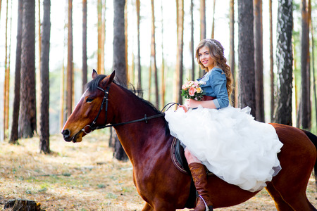 Bride posing on a horseの写真素材