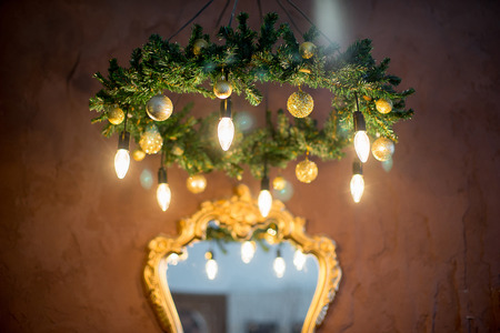 Christmas tree, mirror, chandelier. Christmas interior in purple and gold colorsの写真素材