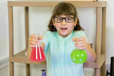 young girl making science experiments in laboratory. educationの写真素材