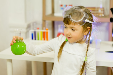 young girl making science experiments in laboratory. educationの写真素材