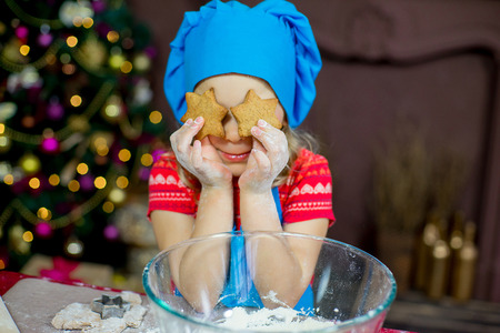 kids baking christmas cookies before the celebration of Christmas. Familyの写真素材