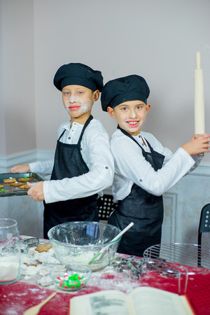 kids baking christmas cookies before the celebration of Christmas. Familyの写真素材