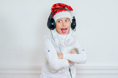 boy pretending he is a Bad Santa with chains, headphones