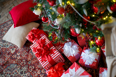 Stylish Christmas interior decorated in white and red colors. Comfort home. New Year and Christmasの写真素材