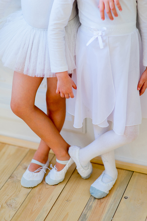 Two young ballet dancers learning the lesson. Try some new poseの写真素材