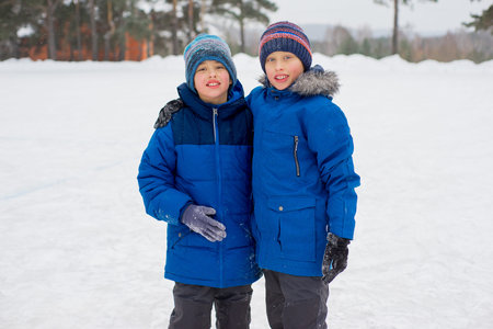 two skater brothers on the iceの写真素材