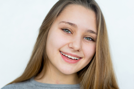 Teenager girl posing on white background isolatedの写真素材